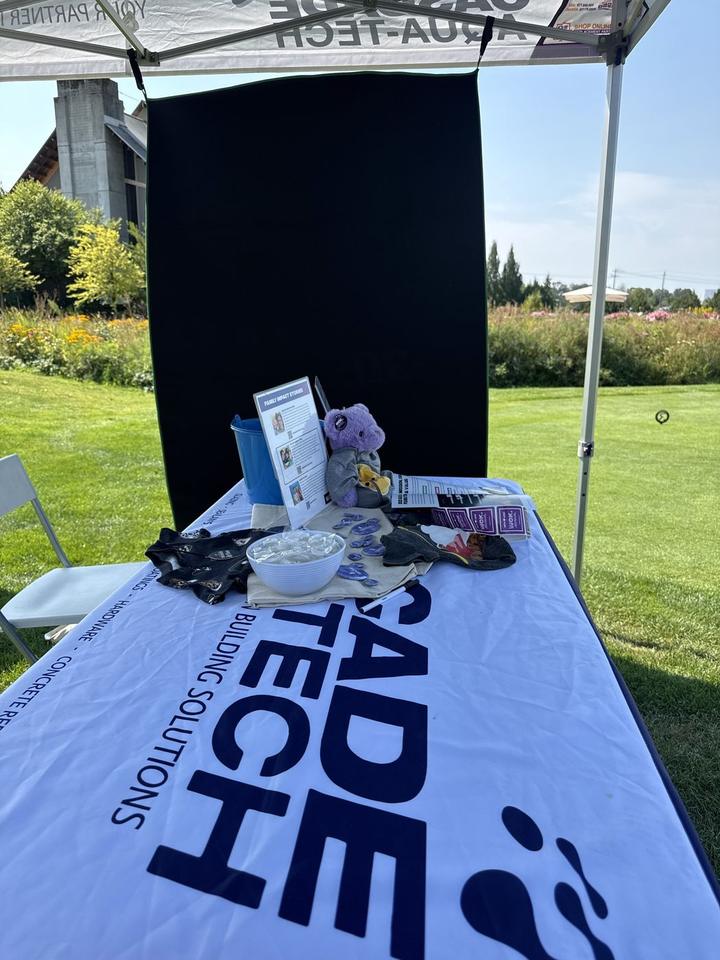 A West Coast Kids Cancer Foundation merchandise table at the Cascade Aqua-Tech tent