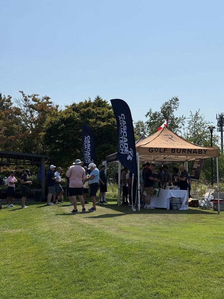 Golfers gathered near the Golf Burnaby and Cascade Aqua-Tech tents at the 2026 tournament