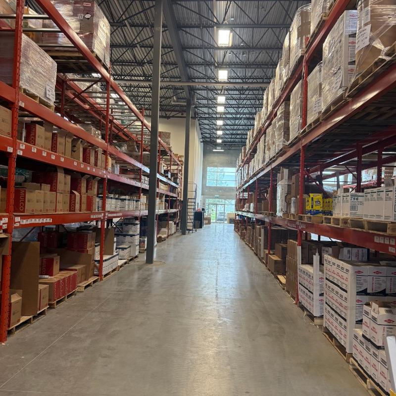 Cascade Aqua-Tech warehouse shelving stocked with building envelope products